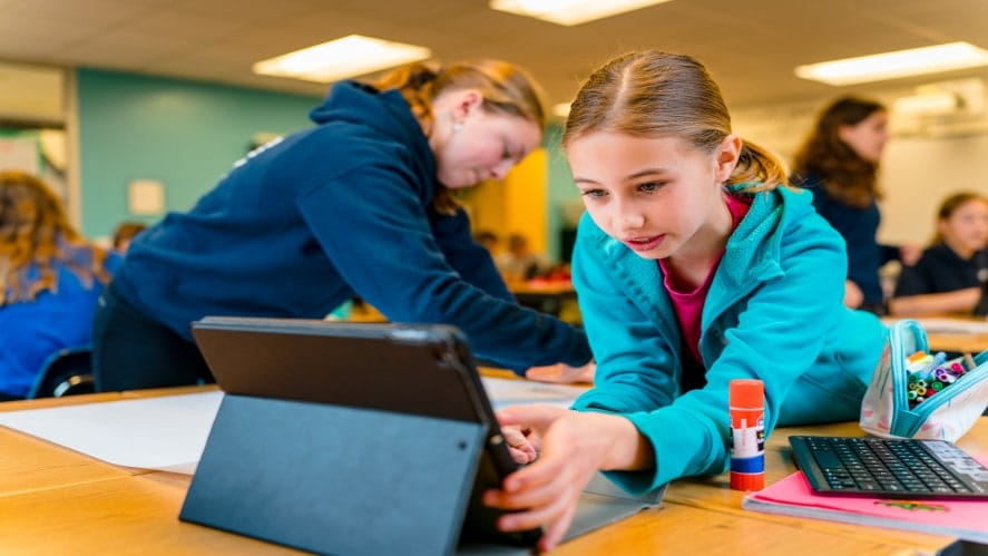 Girl clicking button on Ipad
